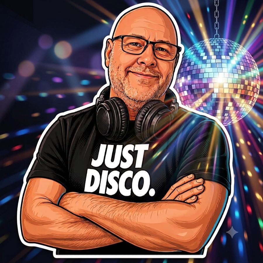 DiscoPauli with headphones under a mirrorball